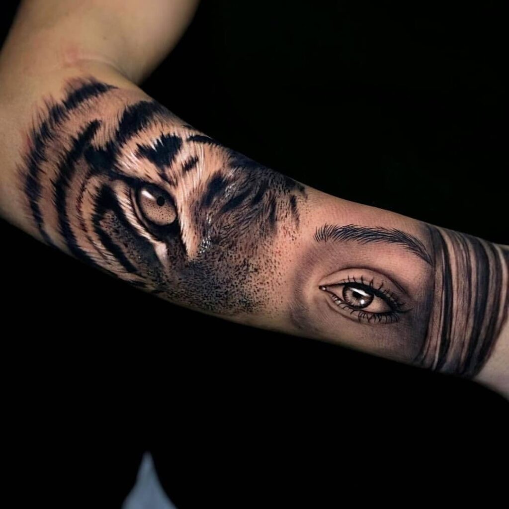 2 TOP 2 Tattoos realism portrait half eyes of a woman and eyes of a tiger in black forearm