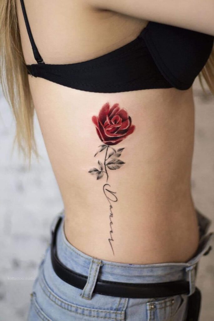 228 Tattoo of Red Roses with stem and inscription on the ribs