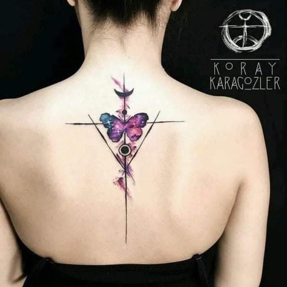 104 Back Tattoo Woman butterfly in watercolor in the middle of the shoulder blades with triangles moon black circles