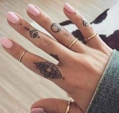 50 Tattoos on the Fingers of the Hands various motives eye of horus lotus flower lunar phases