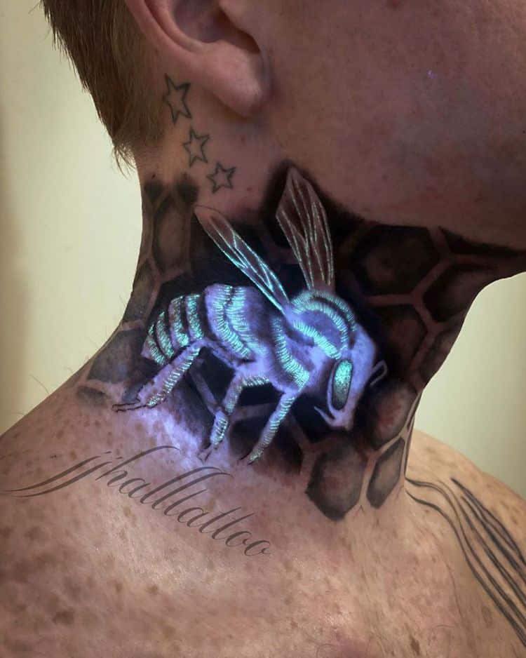 108 Tattoos with UV ink work on the neck with bee and honeycomb in black