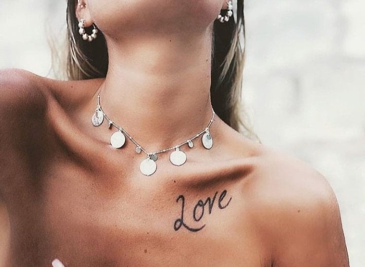 13 Beautiful Tattoos on Women Word Love Love on clavicle