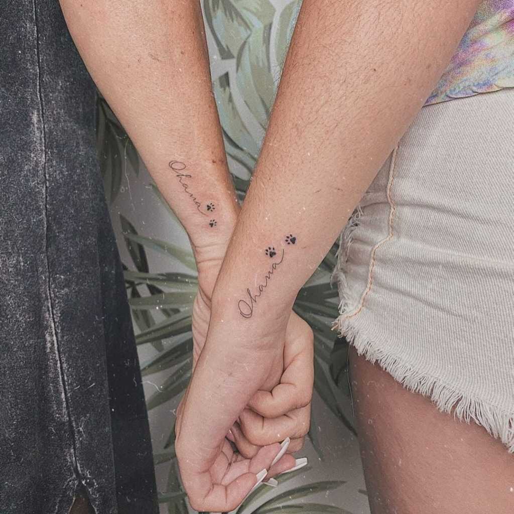 264 Tattoos of Paired Friends Ohana which means family on the side of the wrist cat footprints