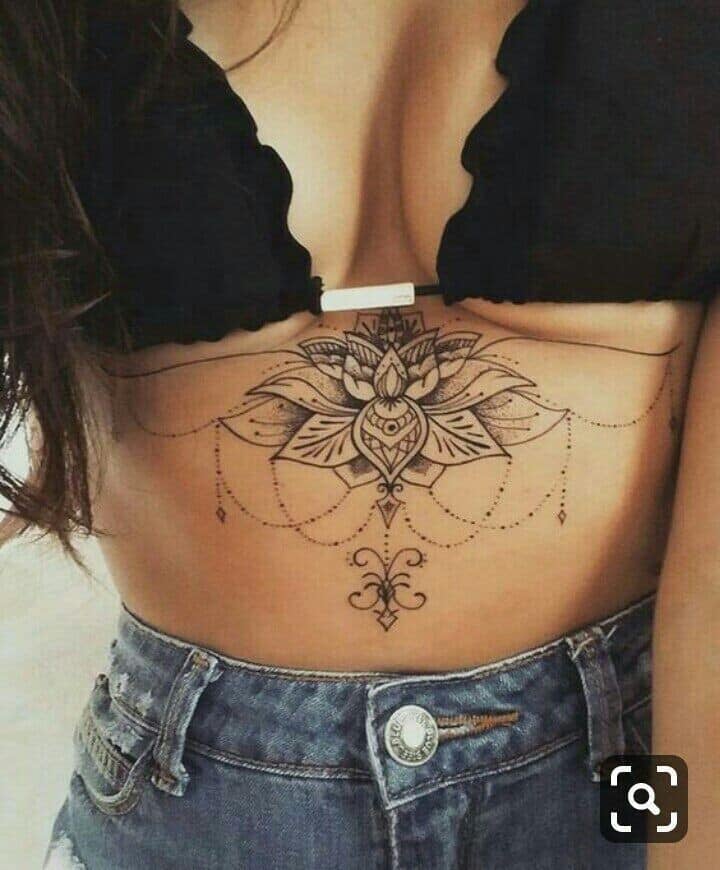 286 Lotus Flower Tattoos in the Middle of the Breasts with hanging chains and ornaments