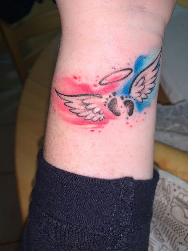 28 Tattoos of Mothers for Children an angel with little feet crown wings red and blue watercolor