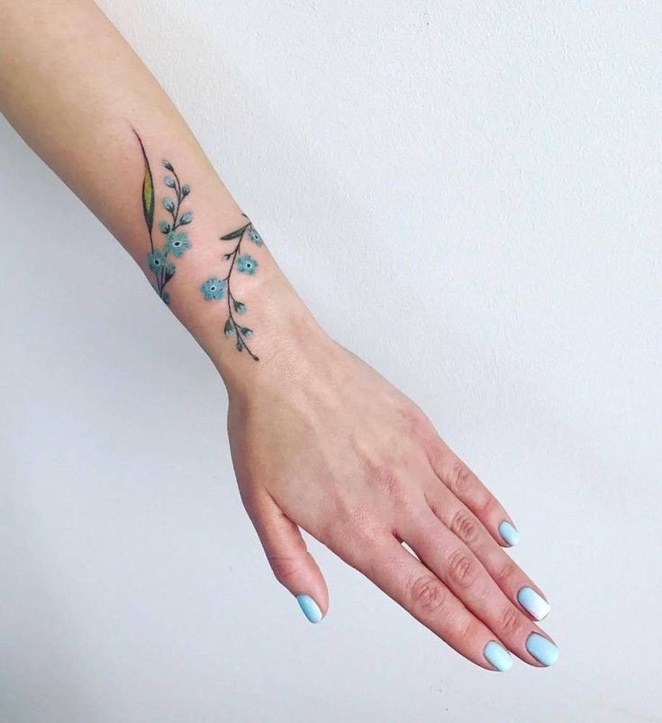3 TOP 3 Flowers and Branches on the forearm for a woman type of spiral-shaped light blue bracelet up to the wrist 16 3