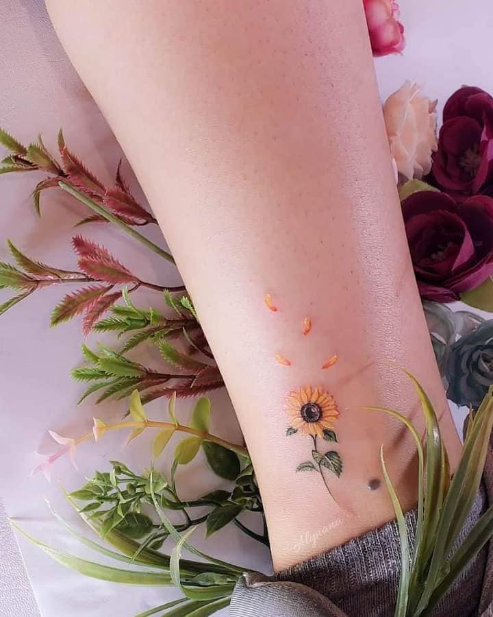 Beautiful Tattoos for Women Beautiful and small Well defined Sunflower on Calf