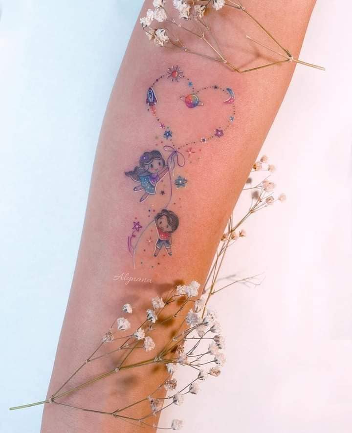 Beautiful Tattoos for Women Nina and Nino holding a heart-shaped bow with stars, flowers, rockets, sun, moon, minimalist on forearm
