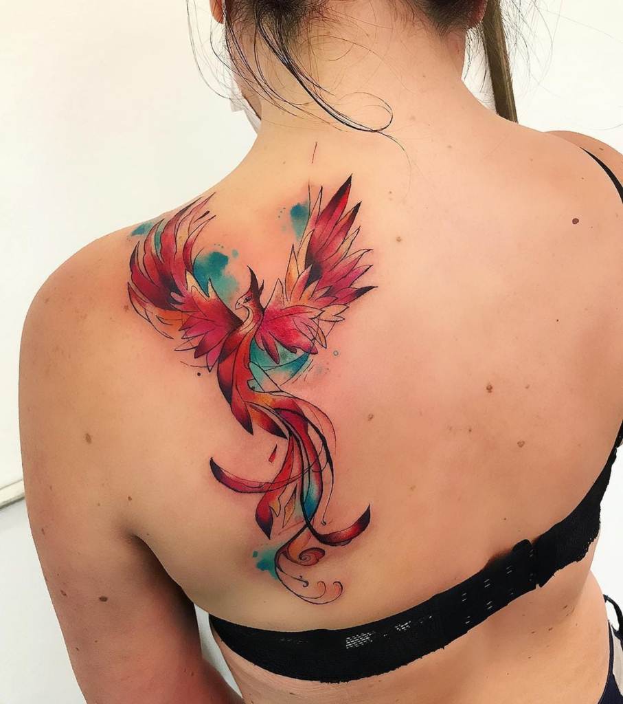 Large Phoenix Bird Watercolor tattoos on the middle of the back with light blue red colors