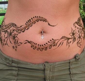 17 Abdomen Tattoos leaves and flowers and ornaments on both sides of the belly