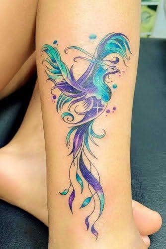24 Tatuaje de Ave Fenix en pantorrilla cian celeste violeta
