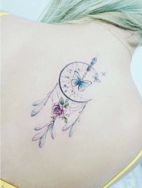 24 Dreamcatcher tattoos on the back between the shoulder blades with blue pink violet butterfly feathers