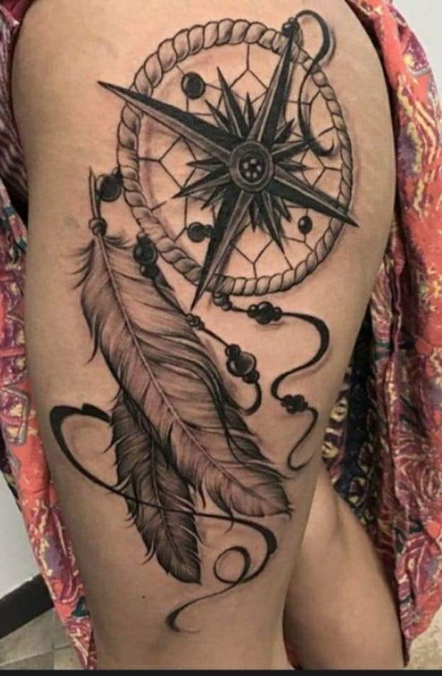 50 Dream Catcher Tattoos in black with wind rose on large thigh