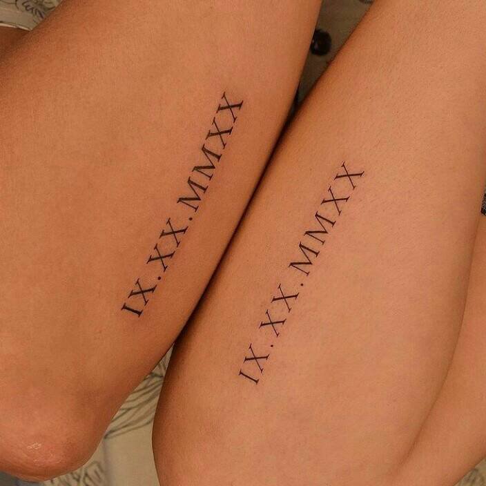 9 Small Minimalist Tattoos Paired Roman numerals on the side of the forearm with special date
