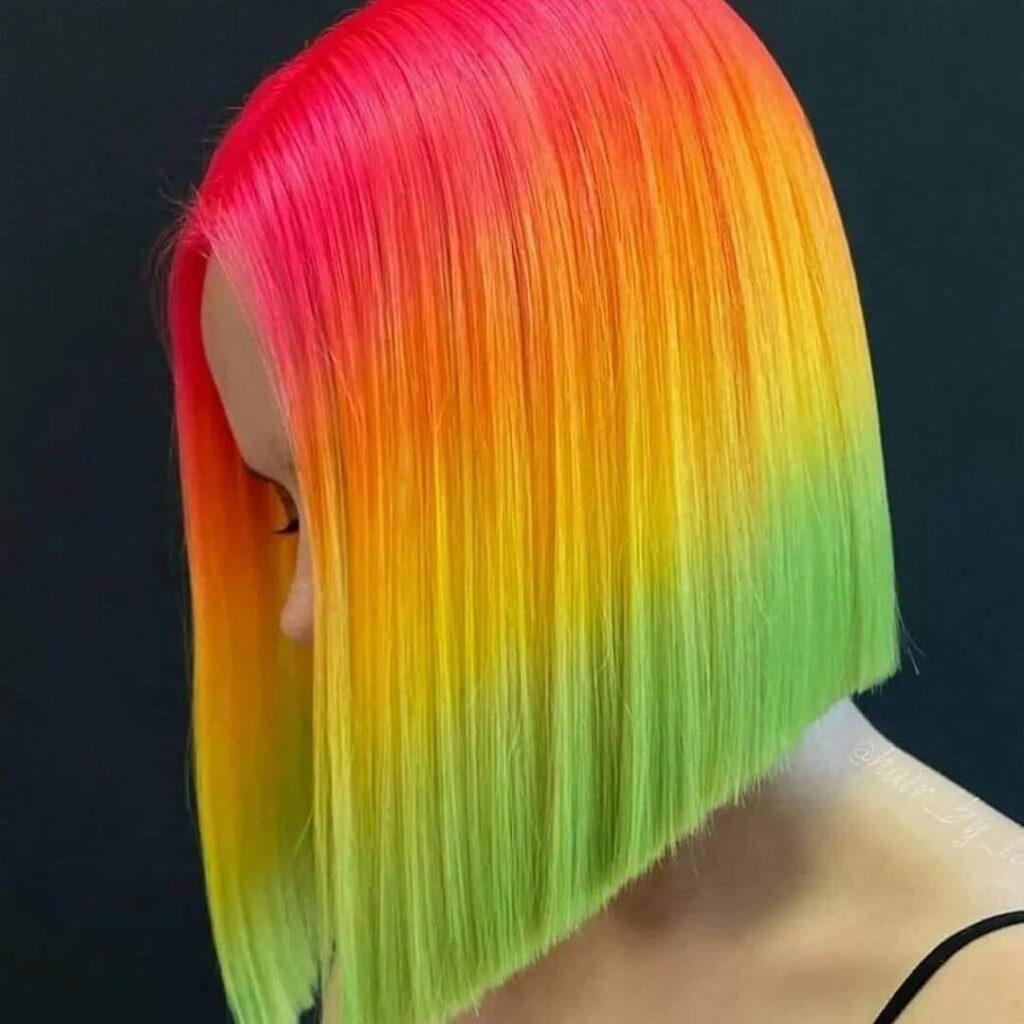 1100 Hair Colors Short diagonal bob cut red orange yellow and green