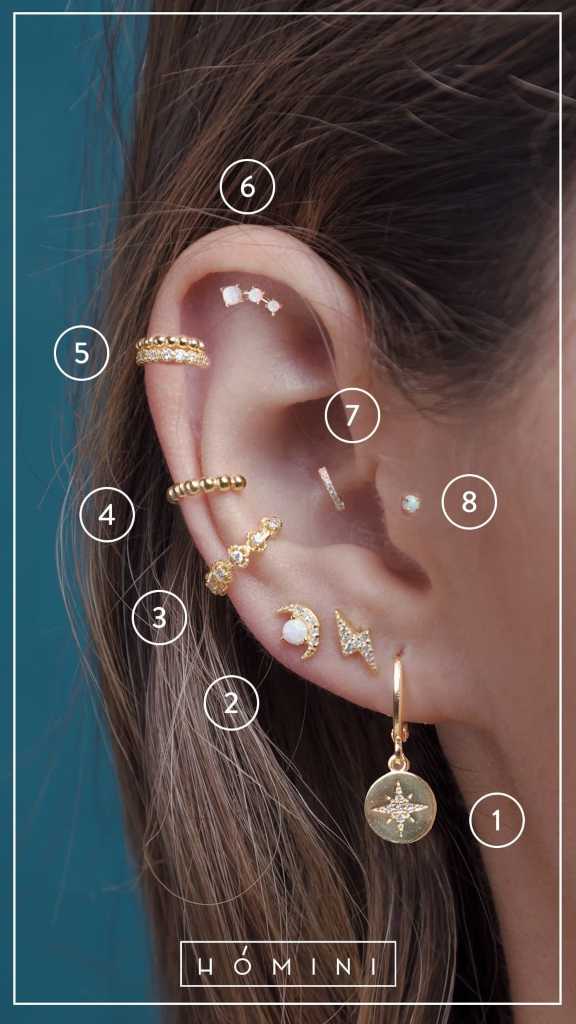 156 Piercings in the Ear different accessories in gold lightning compass rose pendant