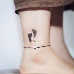 72 Small Baby Feet Tattoos on calf with date