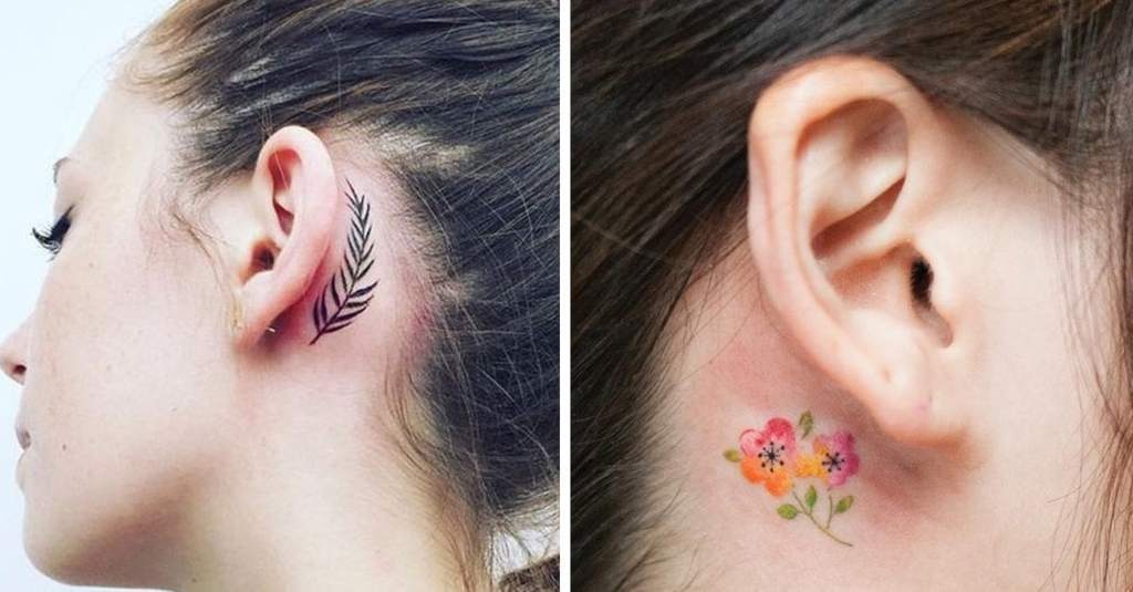 36 Tattoos hinter dem Ohrfarnzweig und den orangefarbenen und violetten Blumen