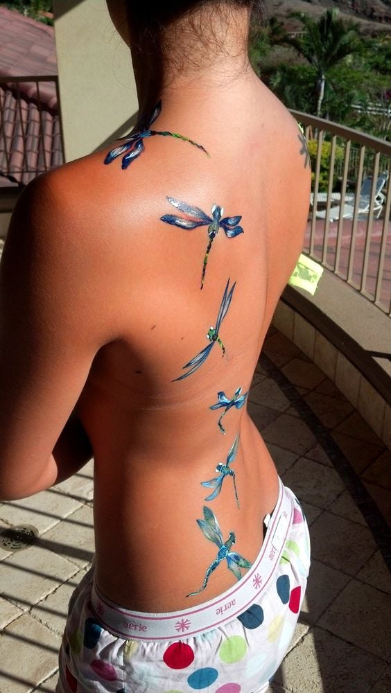 36 Tattoos on the Back of Women Blue and white dragonflies all over the back