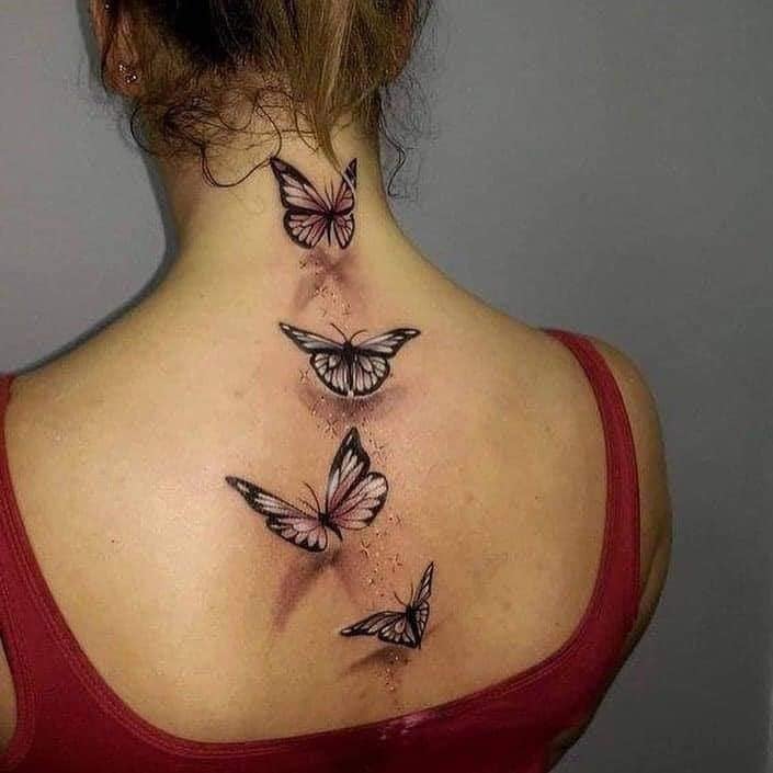 40 Tattoos on the Back of Women Four large 3D butterflies from below to the nape