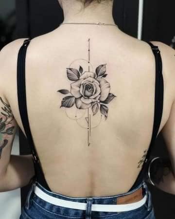 74 Tattoos on the back black rose with leaves and geometric drawings, circles and lines