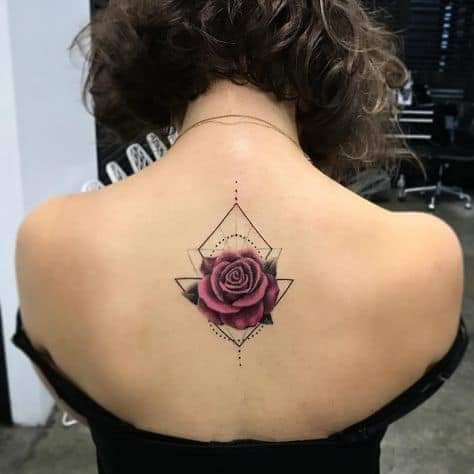 75 Tattoos on the back violet rose with a background of geometric rhombus and triangle drawings