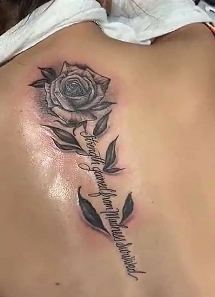 89 Tattoos of Roses on the Black Back with Phrase