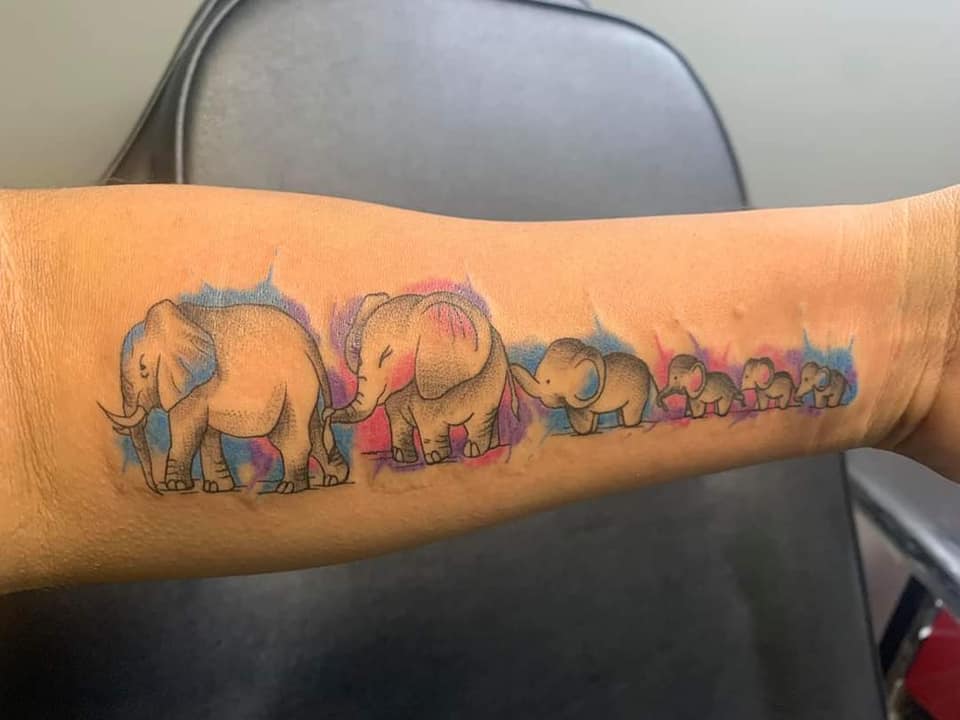17 Most Liked Women's Tattoos July part 2 Family of Elephants Father Mother and Four Children in a Row on Forearm