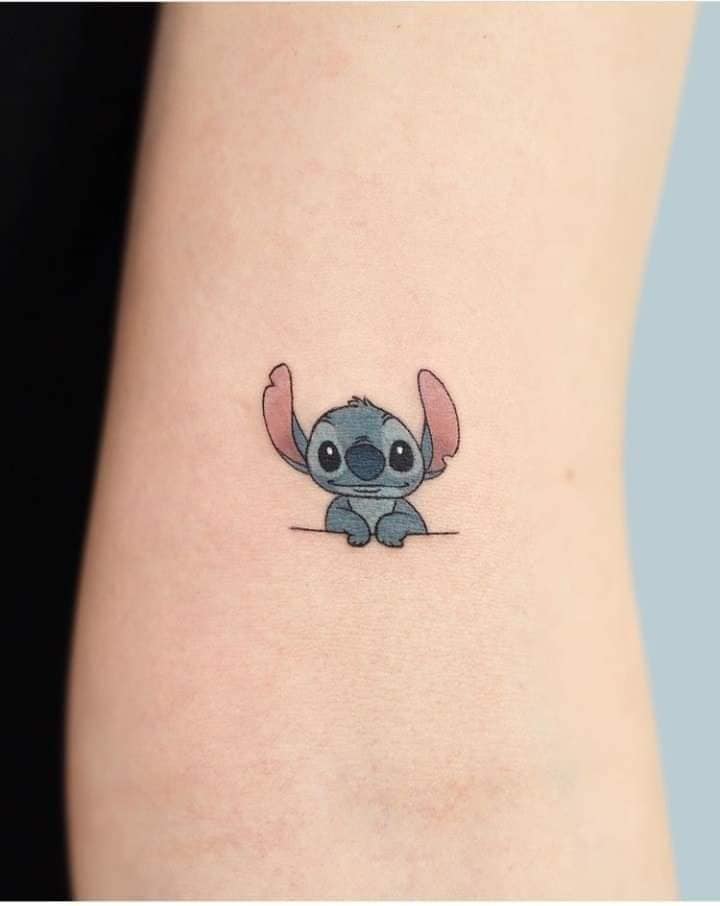 229 Cartoon Stitch tattoo on the arm ears