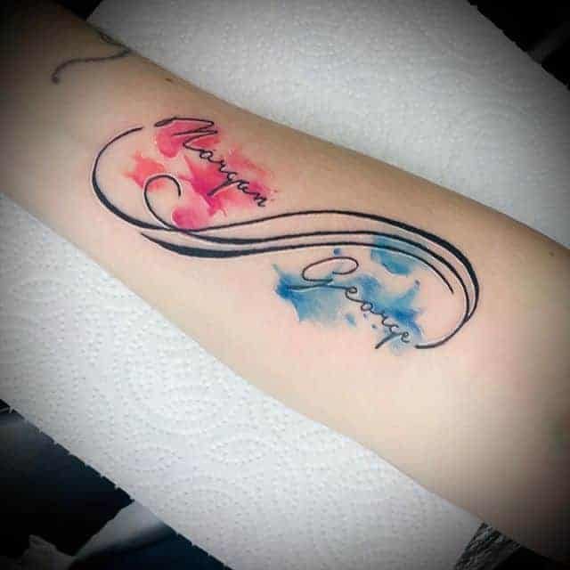 24 Infinite Love Tattoos on the forearm in watercolor with the names Maryan and George