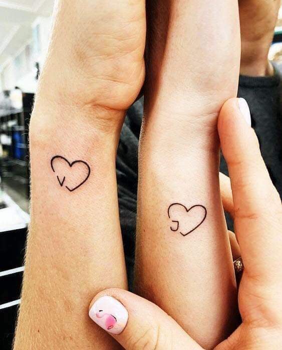 4 TOP 4 Tattoos of Hearts for Couples Sisters Friends on wrists with initials V and J