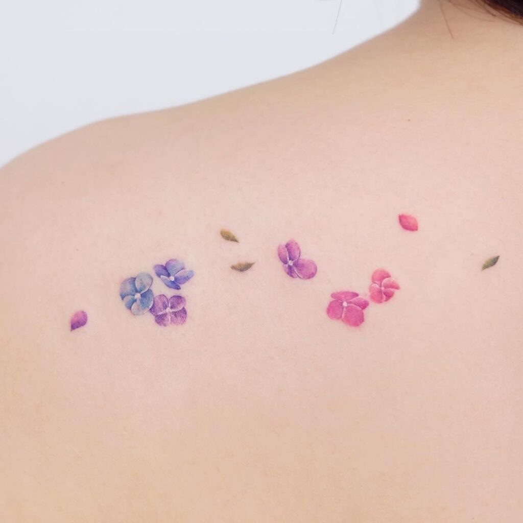 40 Delicate tattoos small flowers on clavicle pink violet fuchsia