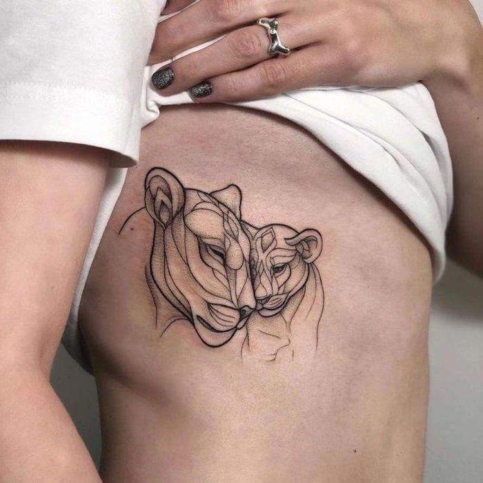 Tattoo of Lioness and her Cubs in Geometric Portrait of Mother with her Son bumping their heads with mimes