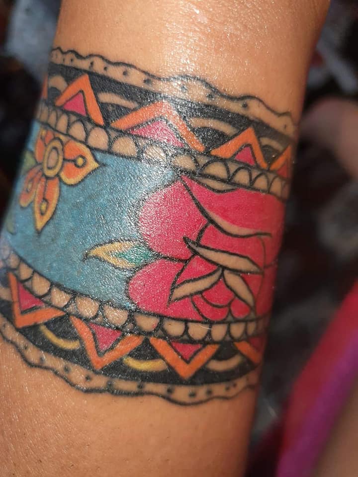 Most liked Women's tattoos July part 2 Colorful Indian bracelet with flowers and guards