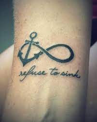 Infinite Love tattoos with an anchor and the phrase refuse to sinks