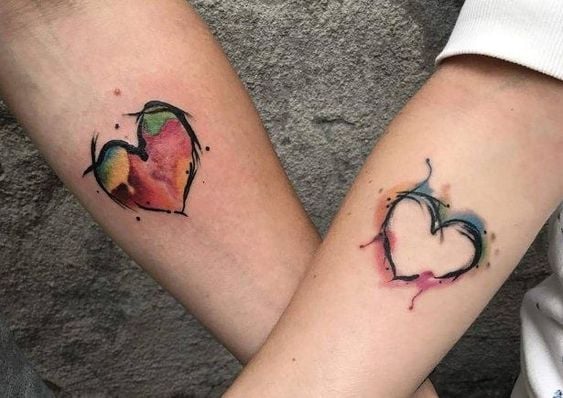 Tattoos of Hearts for Couples Sisters Friends Complementary on forearms in watercolor