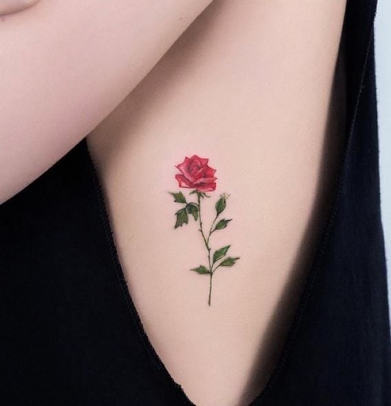 Tattoos of Flowers on the Ribs Small Red Rose with green leaves and stem