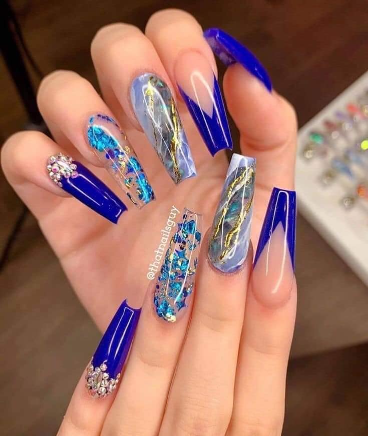Some Blue Acrylic Nails transparent nacre type with golden silver decorations inside