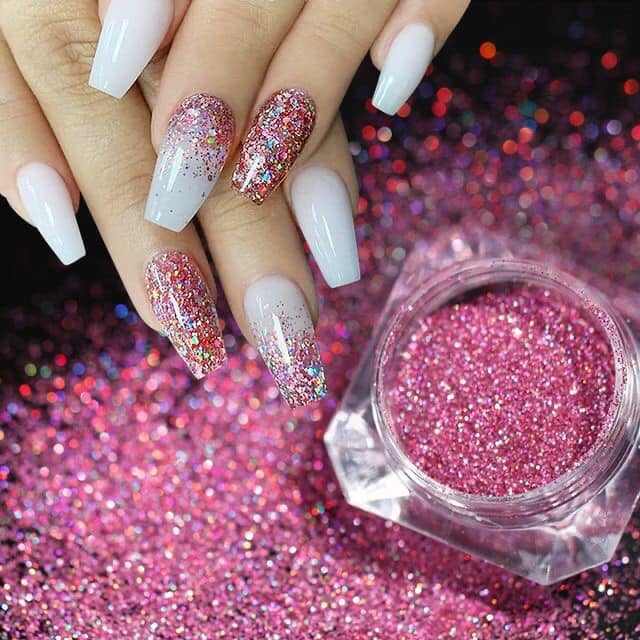 Some Glitter Acrylic Nails in Purple tones and white background