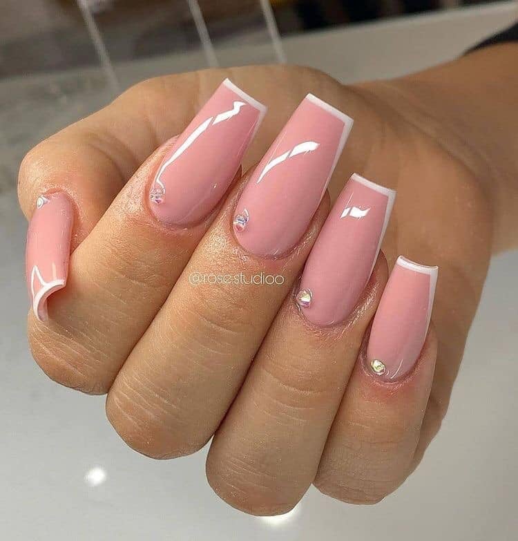 Some Smooth Pink Acrylic Nails with Small Diamonds at the base