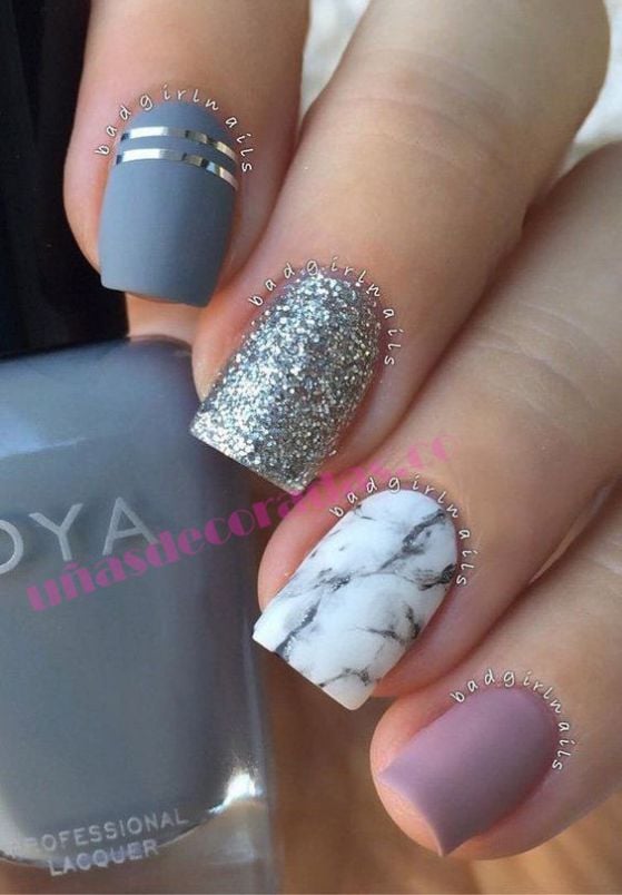 Some Acrylic Nails One finger in each style Gray with two silver stripes Shiny Silver Type Marble or Granite White and Light Violet smooth
