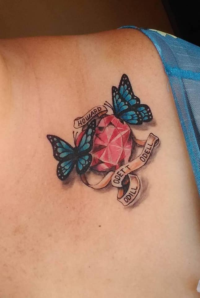 13 Tattoos for women the most liked Ruby stone and Blue butterflies names Howard Odett Odell Odill on lower back