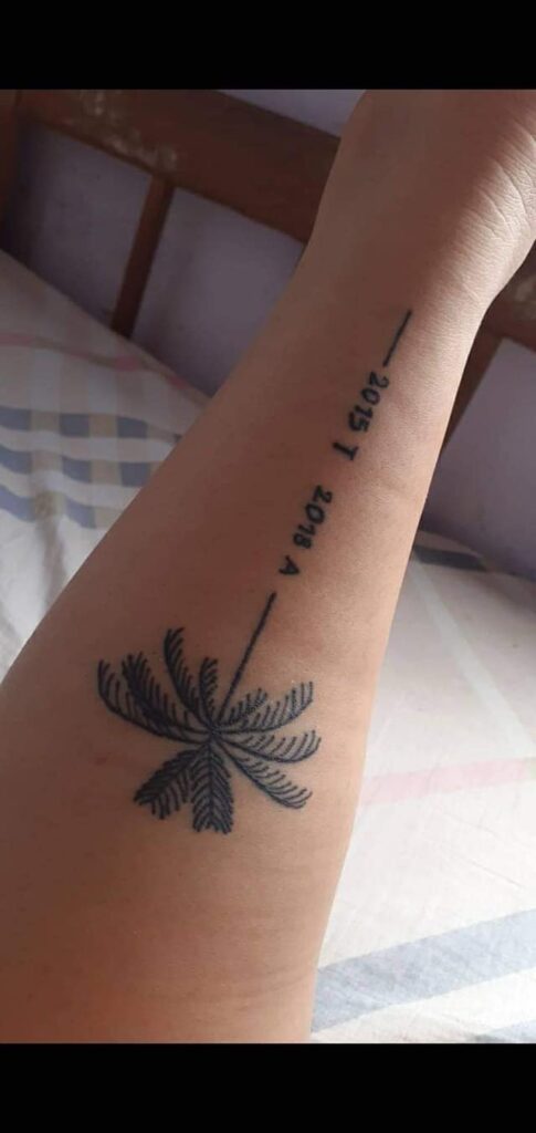 35 Tattoos for women the most liked Palm tree and inscriptions of dates on the forearm