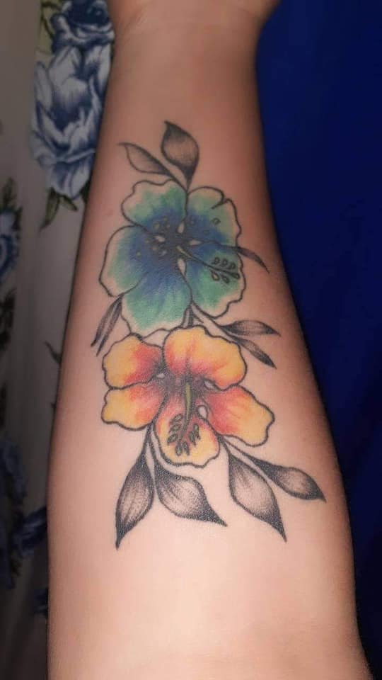 36 Tattoos for women the most liked Orange and Celestial Blue Flowers on the forearm