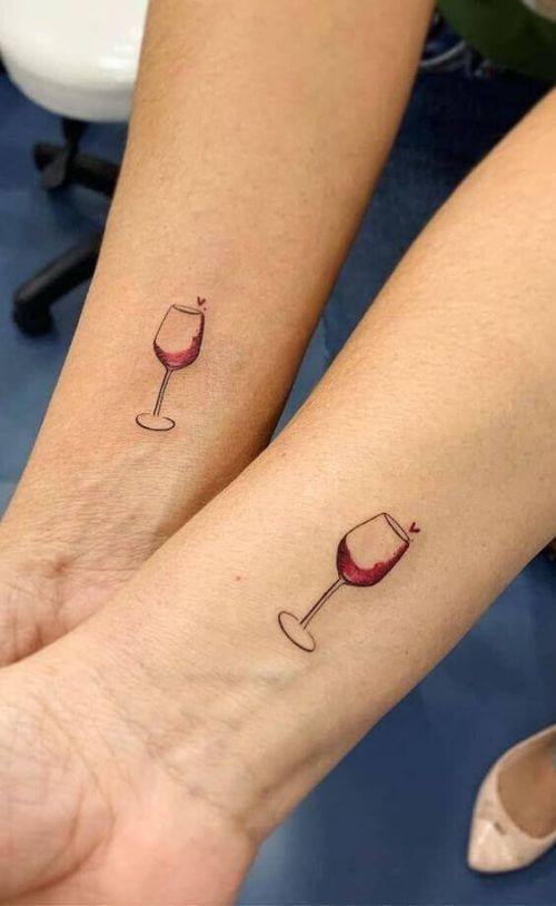 4 TOP 4 Tattoos for best friends two glasses of wine on the forearm with a small heart