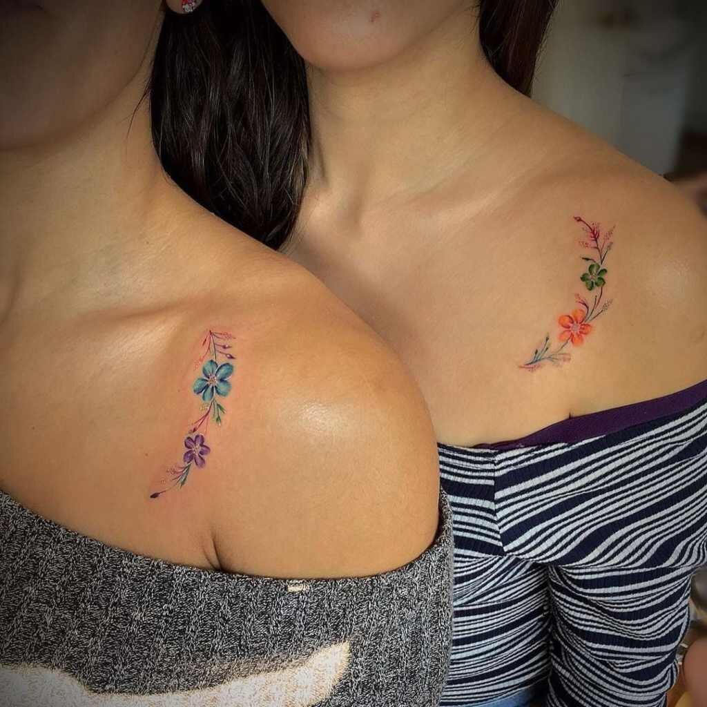 4 TOP 4 Tattoos for best friends bouquet of flowers with flowers of various colors on each clavicle