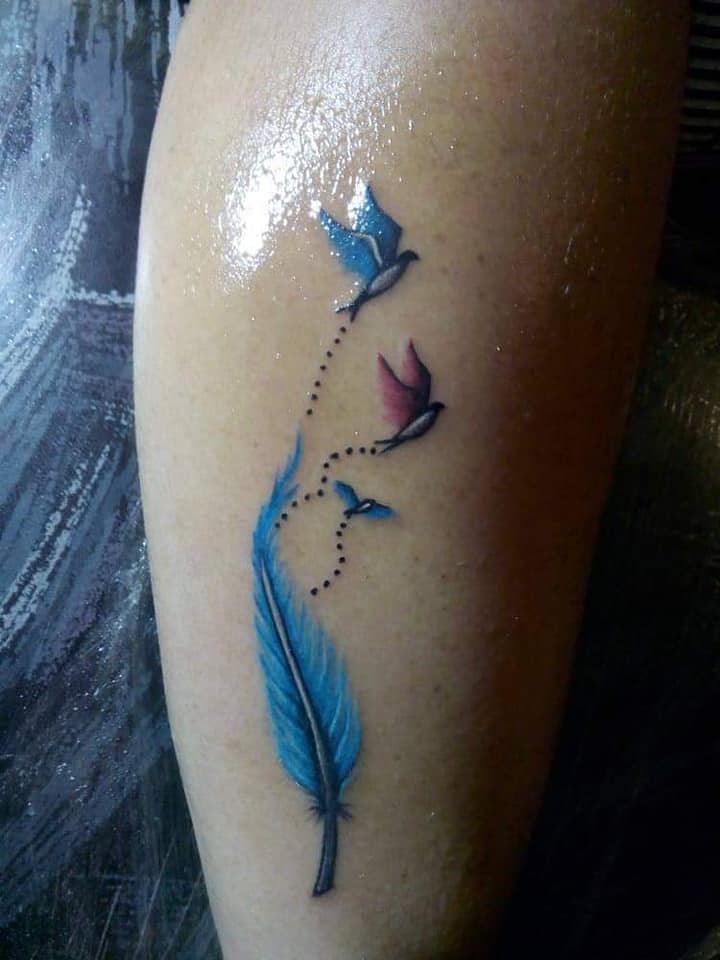 6 Tattoos for women the most liked Feather and Blue Birds two large parents and a small one