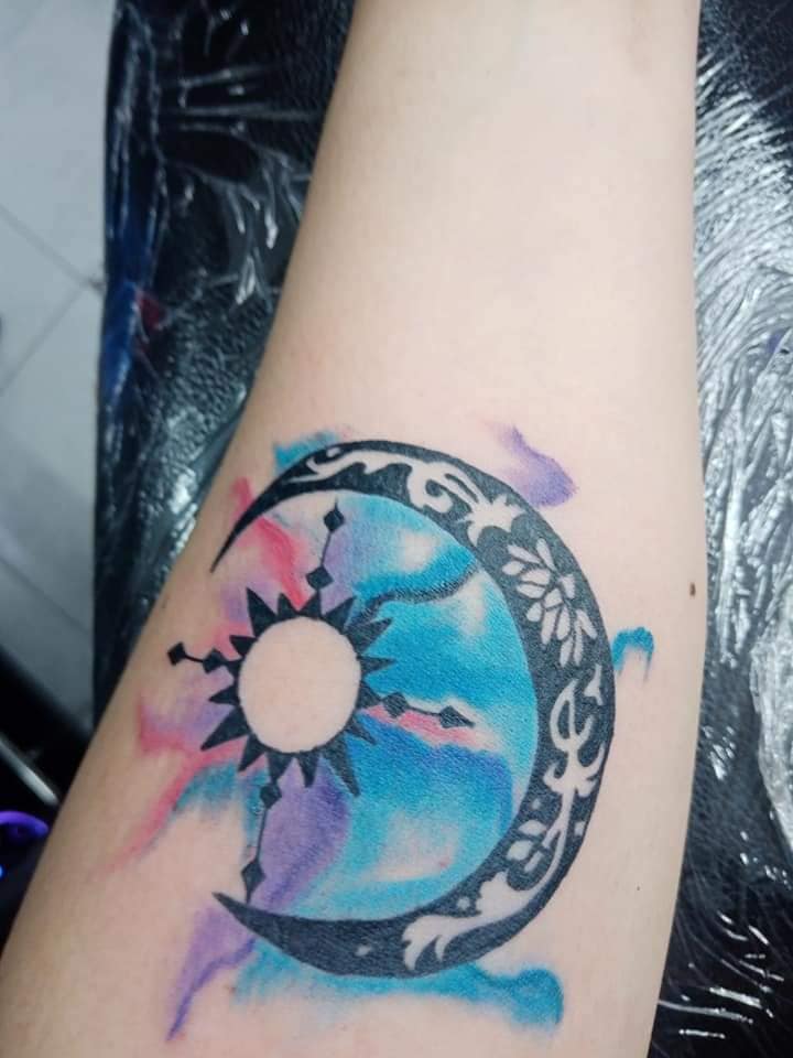8 Tattoos for women the most liked Moon and Inside Sun with Watercolor on the arm