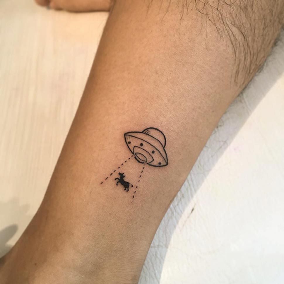 Small UFO Abducting Cow Tattoos on Calf