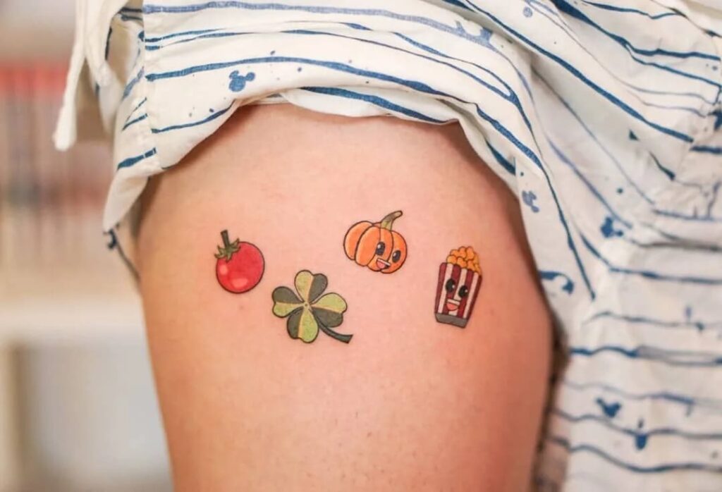Small Tattoos Tomato Pumpkin PopCorn Clover on arm